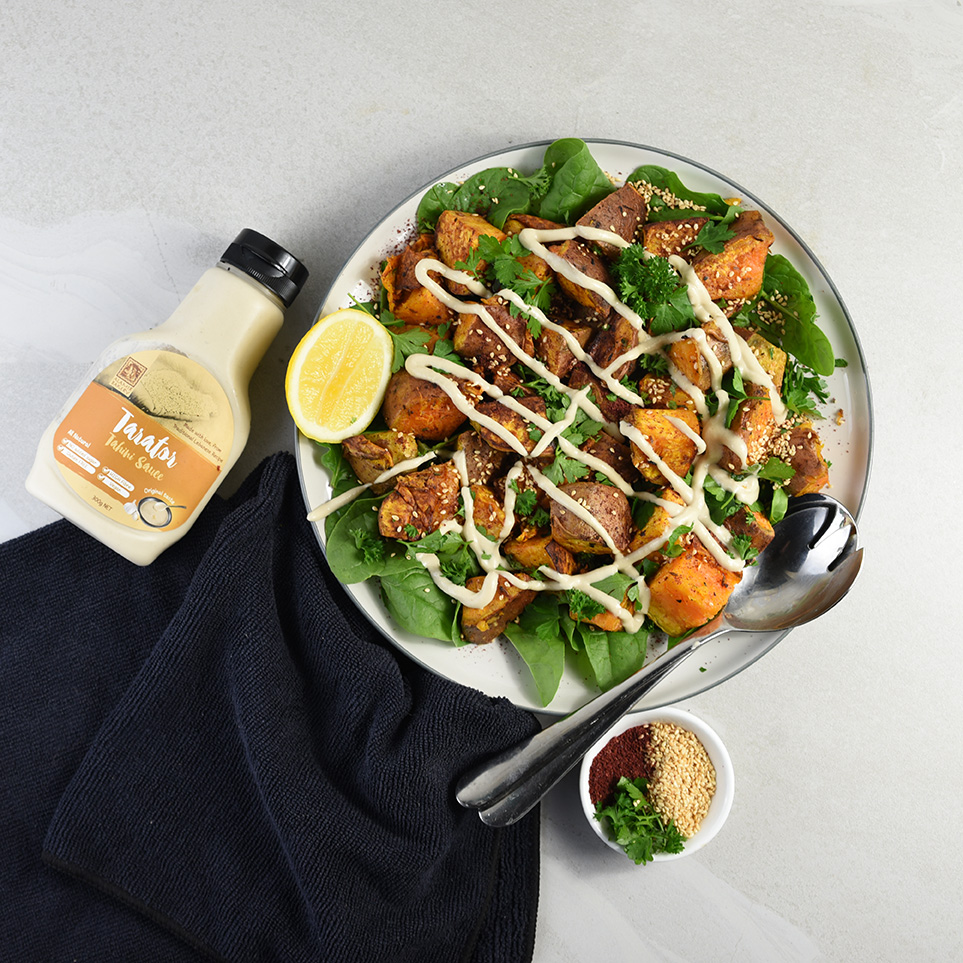 Roasted kumara and spinach salad with creamy Tarator (Tahini dressing)