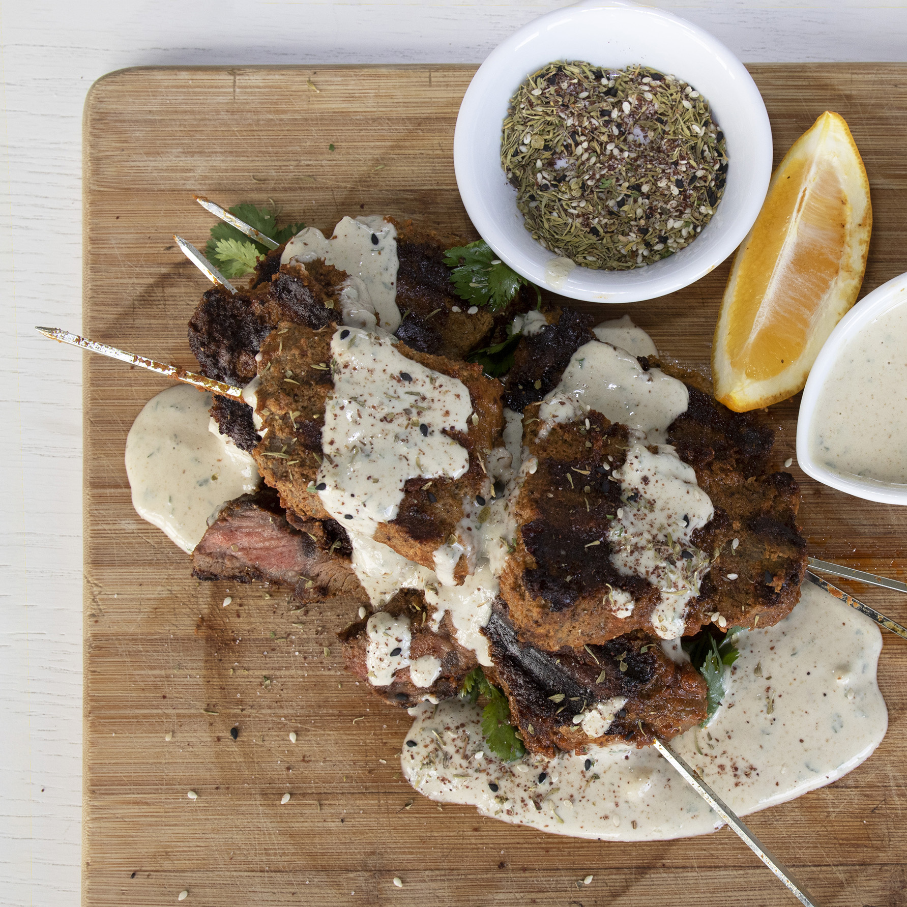 Caramelised beef, marinated till tender in harissa paste and tahini is made even more irresistible drizzled with spiced tahini dressing